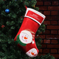 Three Christmas stocking ornaments showing elk, elderly gentleman and snowman designs in American folk art style