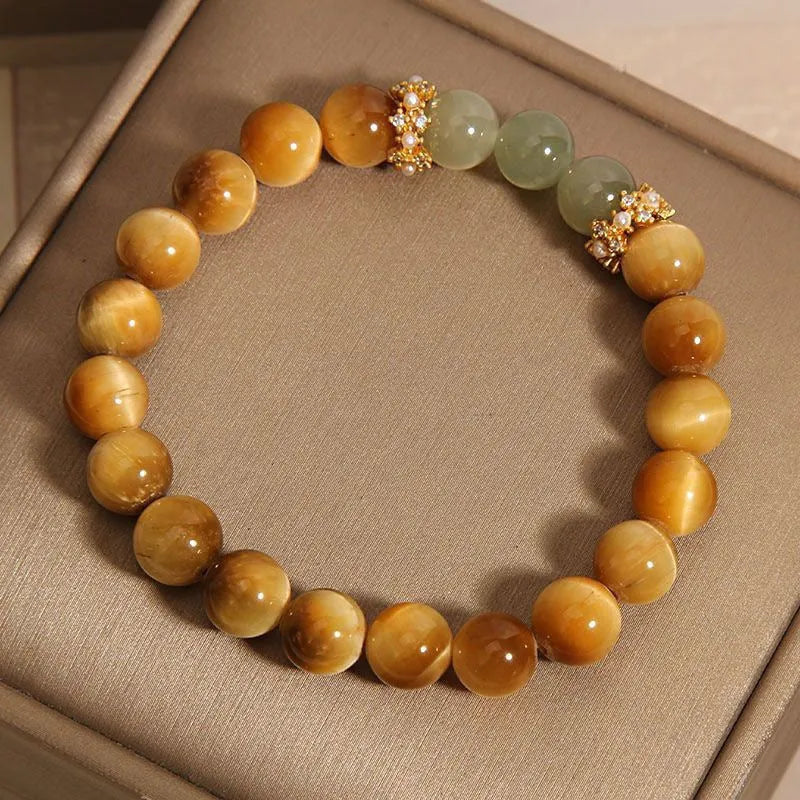 Natural tiger's eye and Hetian jade bracelet with diamond treatment showing golden gourd pattern