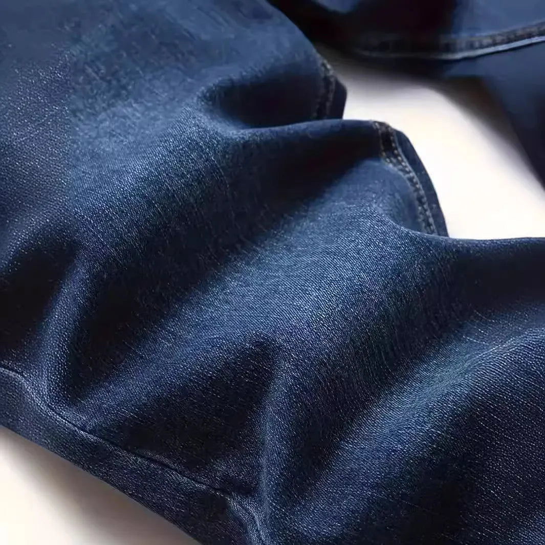 Dark blue men's slim fit skinny jeans with stretch cotton fabric on a mid waist.