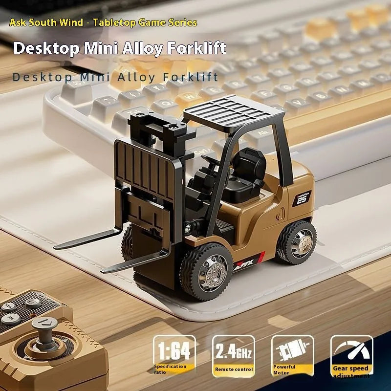 Miniature silver alloy remote control forklift model with black accents on a pallet.