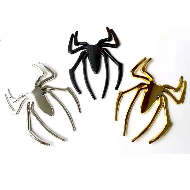 Zinc alloy 3D spider bumper sticker in metallic colours on a car bumper.