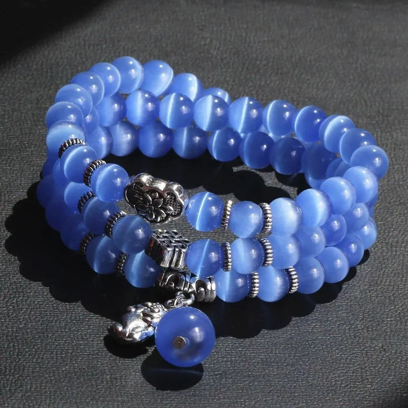 Crystal opal bracelet with 8mm cat eye bead and lucky cat charm in three-ring wrap design