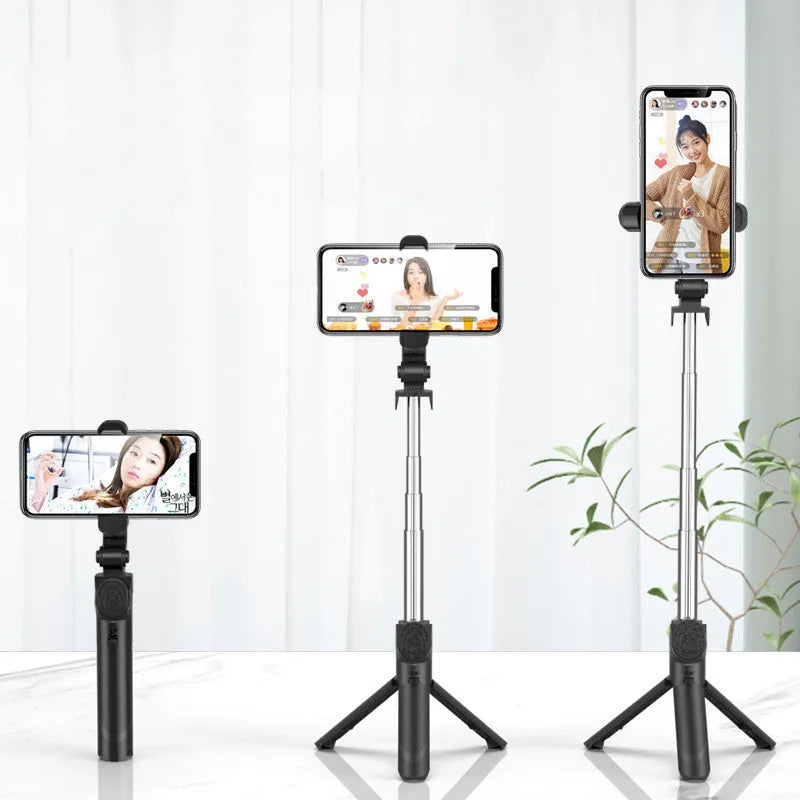 Selfie stick with aluminium alloy body and phone holder in tripod mode on a desk