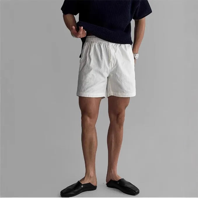 Cotton loose-fitting sports shorts in black, white, and khaki colours for summer wear