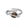 Saturn-inspired adjustable open ring with white gold electroplated finish and silver base