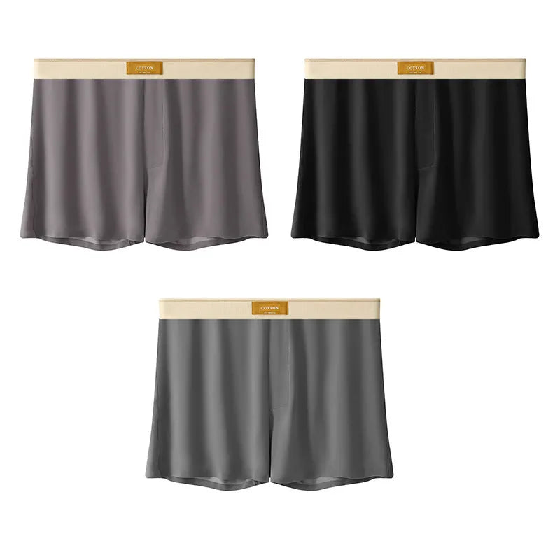 Pack of three men's solid colour loose fit ice silk boxer shorts on a mid waist.