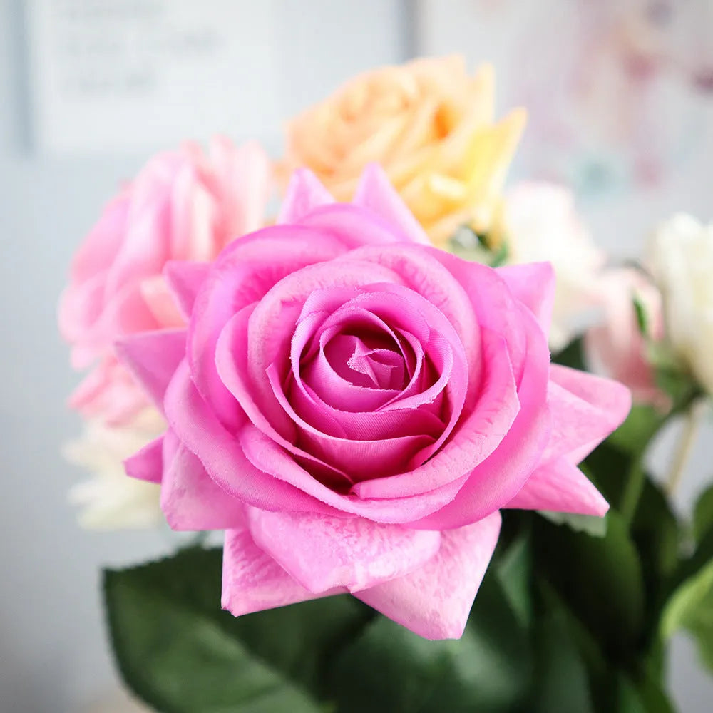 Artificial silk flower bouquet measuring approximately 42cm long with 8.5cm flower heads in multiple colour options