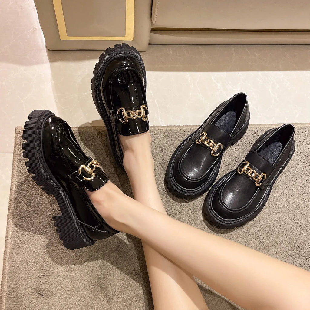 British retro round toe flat heel shoes for women in black glossy finish showing side view