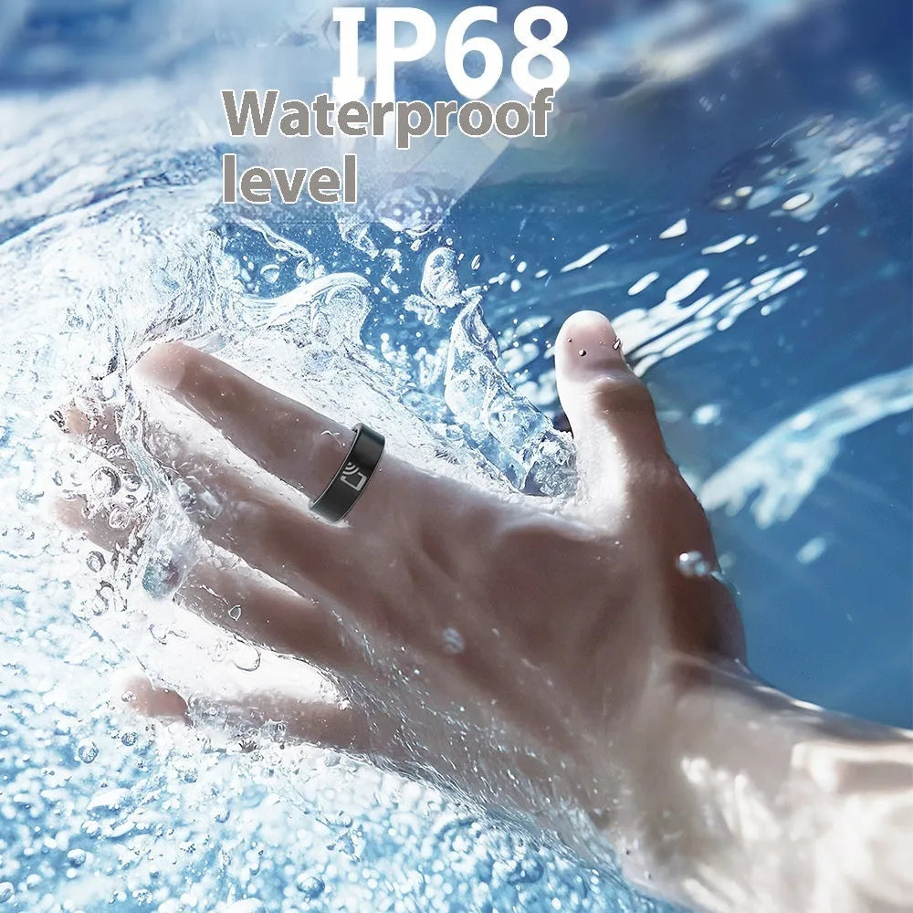 Black ceramic smart ring for health monitoring on a finger next to its charging case.