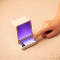 Portable classic computer-shaped Bluetooth speaker in light gray with lighting and voice prompt on a desktop