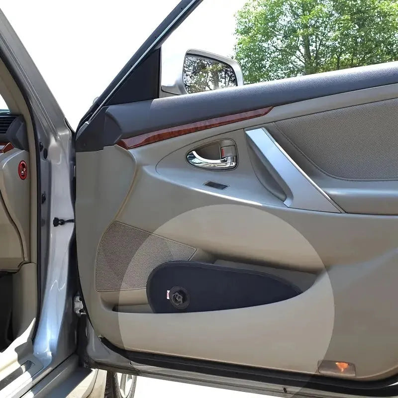 Black stretchy car window shade for baby with suction cups attached to a car side window