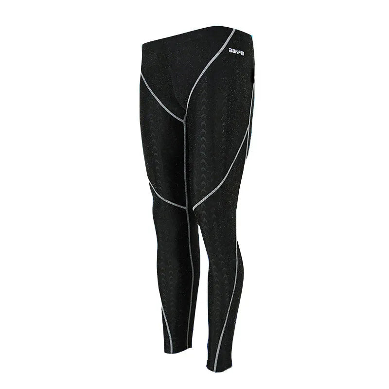 Men's black nylon cropped swimming trunks with a grey contrast stripe and internal mesh lining.