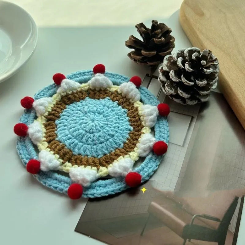 Round wool cake coaster 9cm diameter on a wooden table