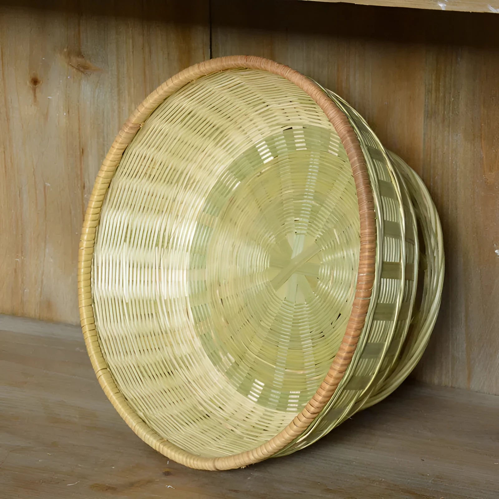 Handmade bamboo storage basket with woven construction in three size options