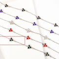 Women's stainless steel bracelet with three triangular diamond charms in geometric design with coloured stones