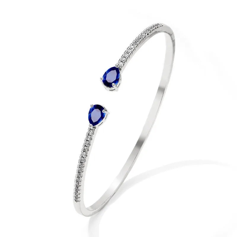 Copper bracelet with inlaid zircon stones in adjustable cuff design