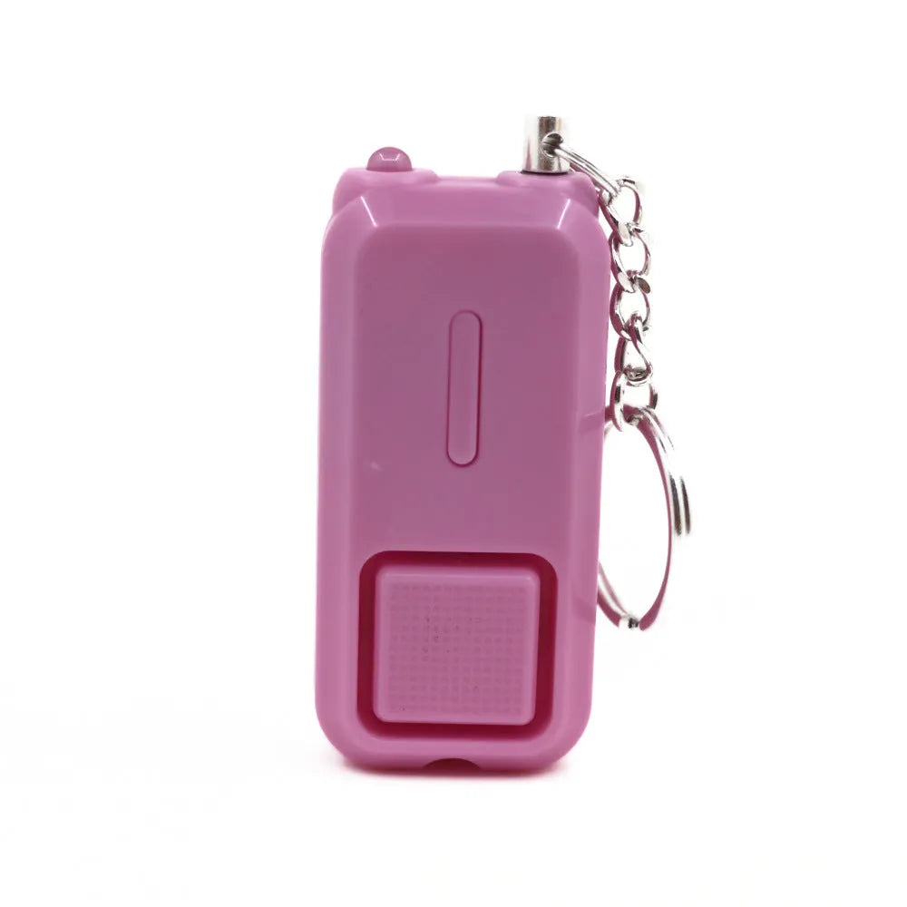 ZQ-202 personal safety alarm in pink, showing compact keychain-sized design.