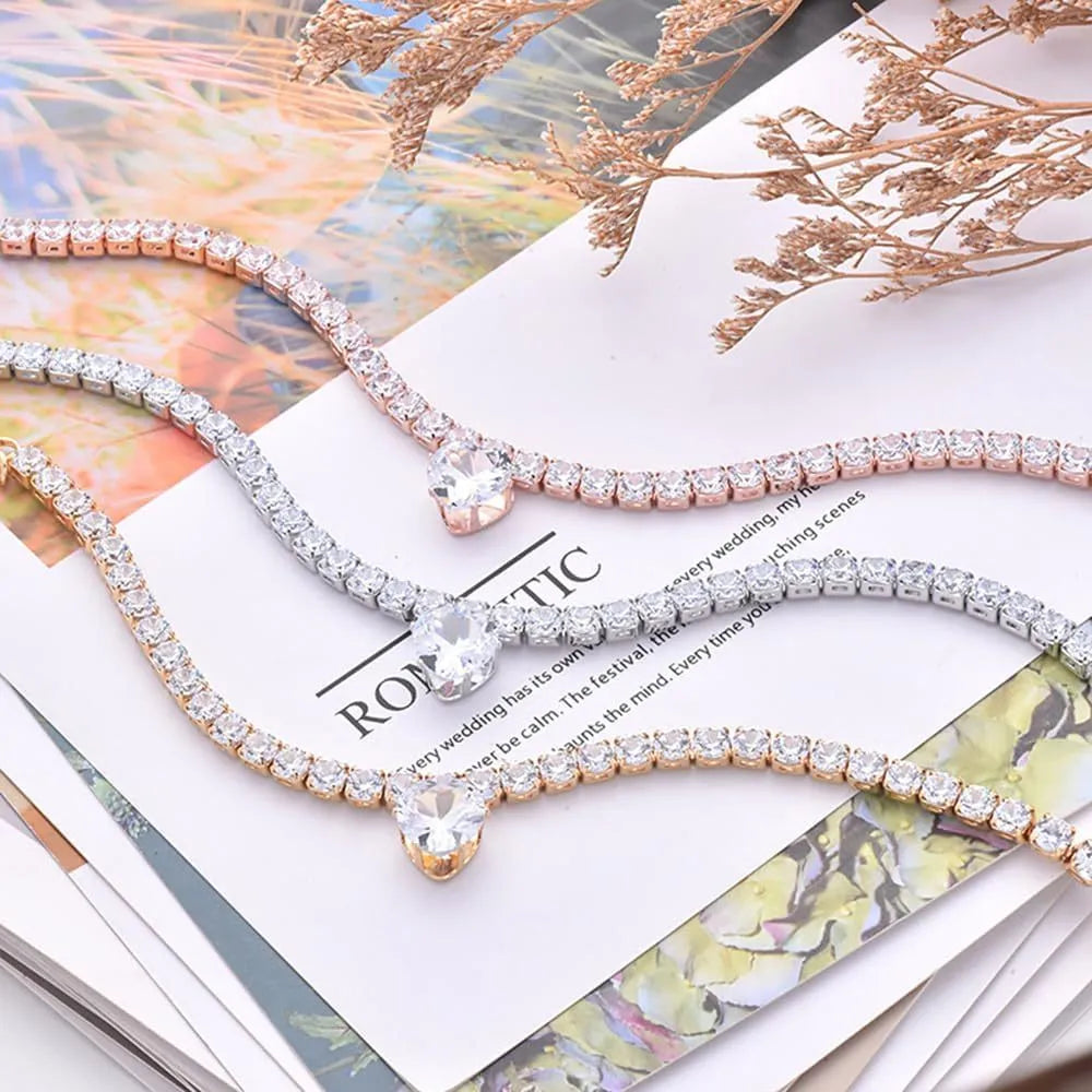 Pet collar with rhinestone heart design in gold, platinum, and rose gold colours on adjustable chain