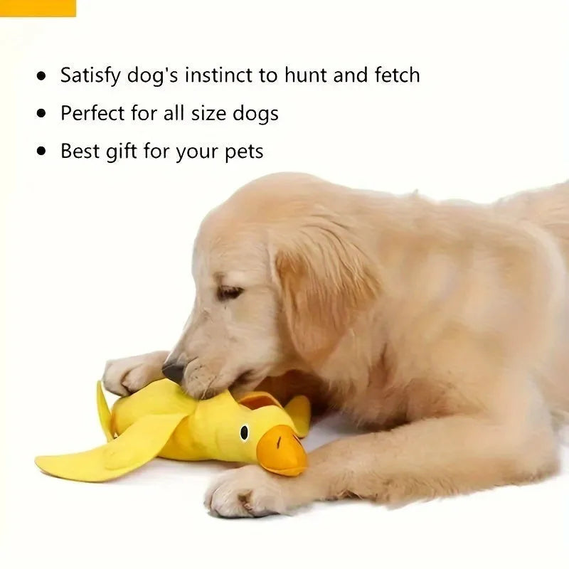 Yellow plush teddy dog toy with a attached duck doll and visible treat pockets on a white background.