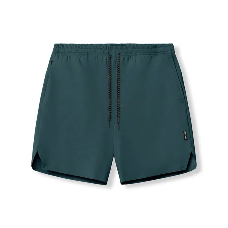 Men's quick-drying polyester sports shorts in knee length with multi-bag design, black colour, front view