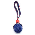 Blue natural rubber dog ball attached to a rope toy for small breeds, showing textured surface.