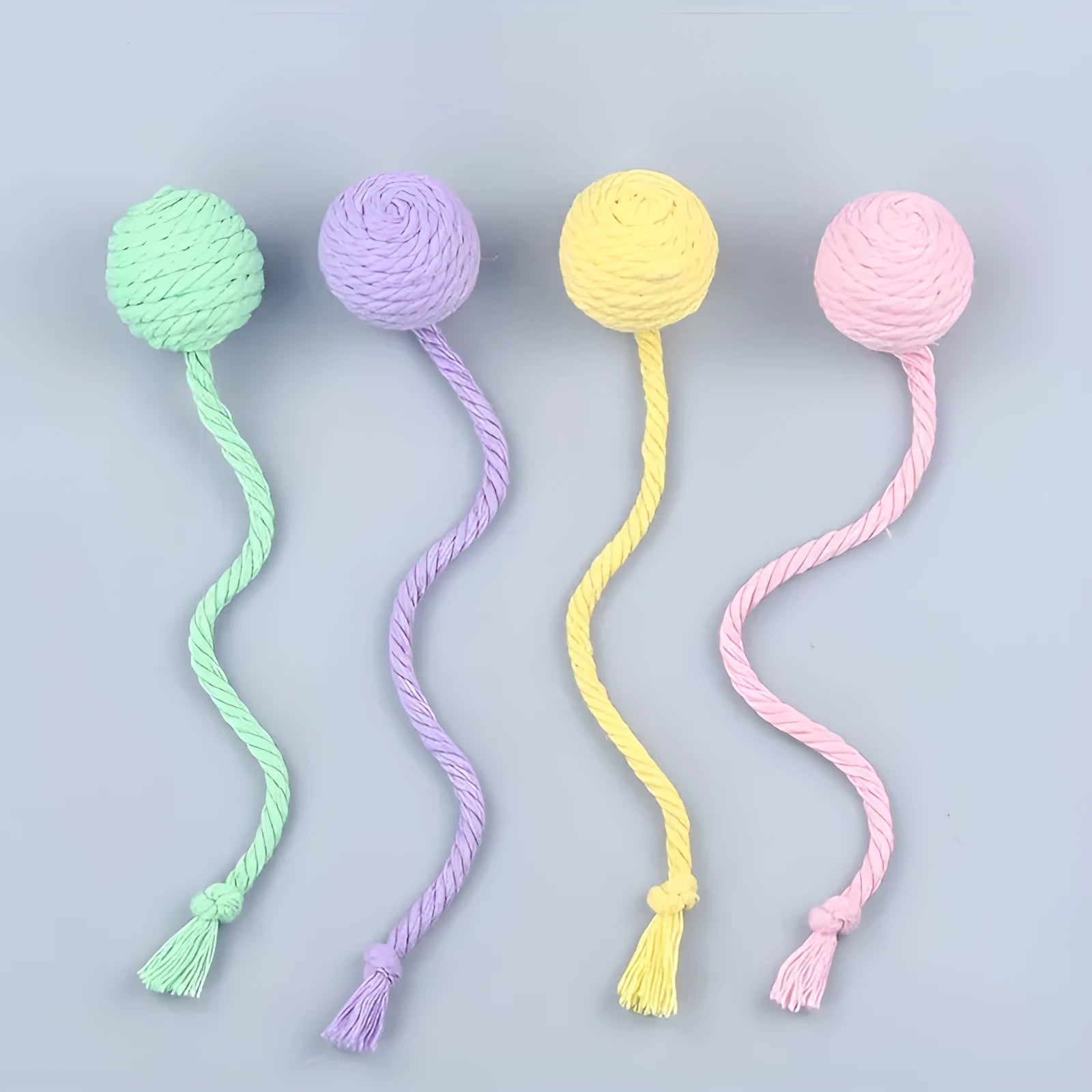 Cat toy ball with rope handle and bell inside in bright colours for kitten play