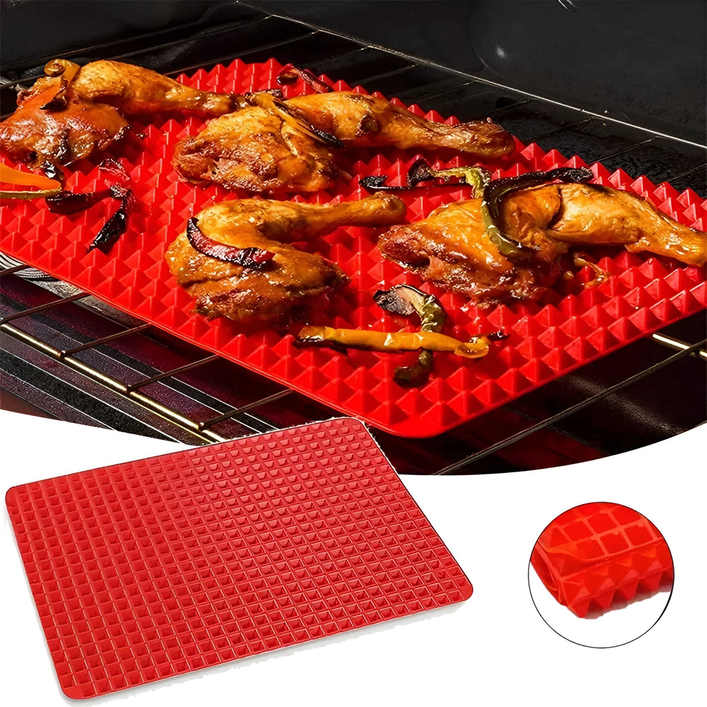 Red non-stick silicone pyramid cooking mat with grid on a baking tray for oven or BBQ use