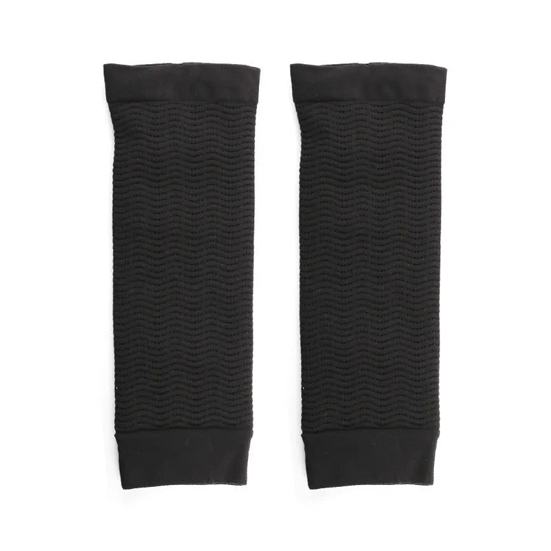 Women's black nylon shaping arm sleeves showing free size design for discreet wear under clothing
