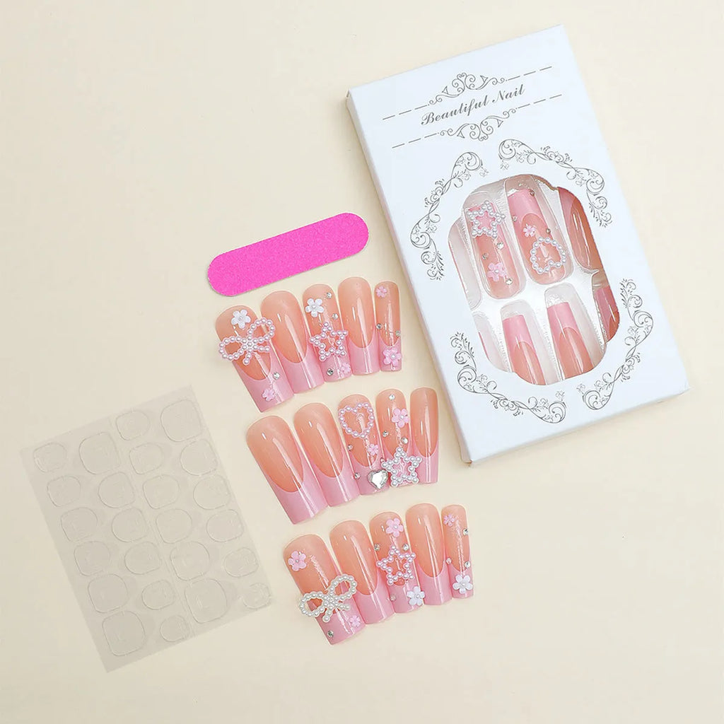 Super long false nails with a red love pattern, spot drill details, and a bow accent on a plastic armour suit.