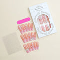 Super long false nails with a red love pattern, spot drill details, and a bow accent on a plastic armour suit.