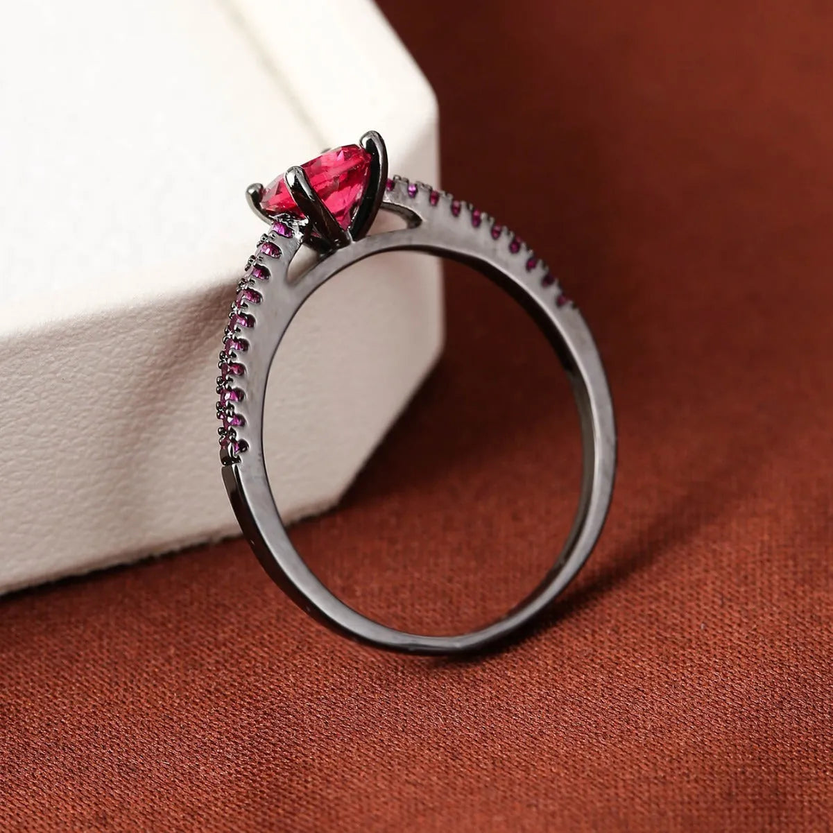 Copper hexagonal geometric ring with electroplated colour finish and CZ stone.