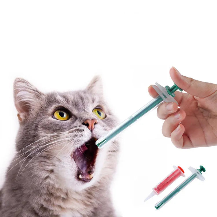 Two silicone-tipped pet pill shooters in different sizes on a white background.