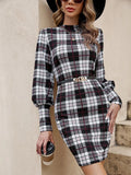 Black tight-fitting dress with lantern sleeves and leather stitch detail.