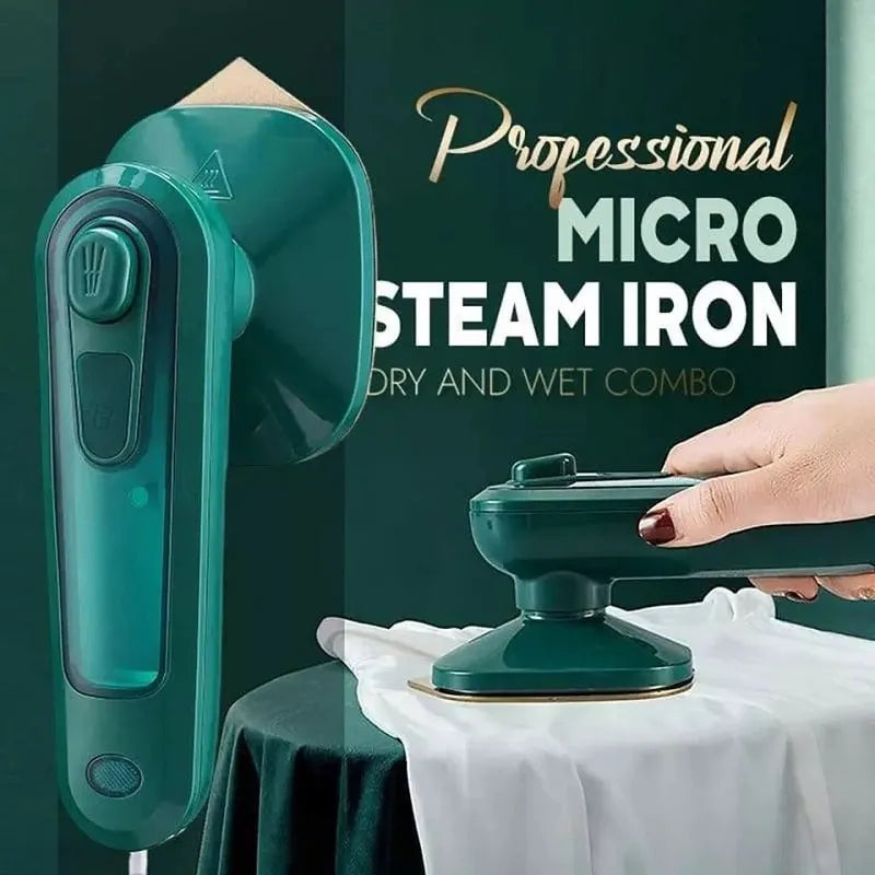 Handheld portable garment ironing machine in dark green with large titanium panel, UK plug