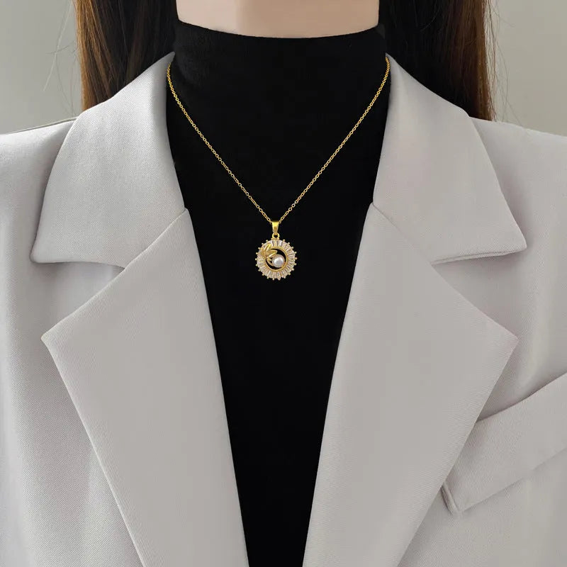 Titanium steel geometric jewellery set with round ring, square pendant necklace, and leaf-shaped stud earrings on a silver-tone chain.