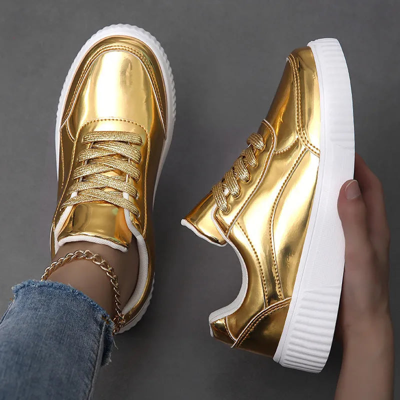 Gold sequined platform sneakers with round toe and thick MD sole on a white background.