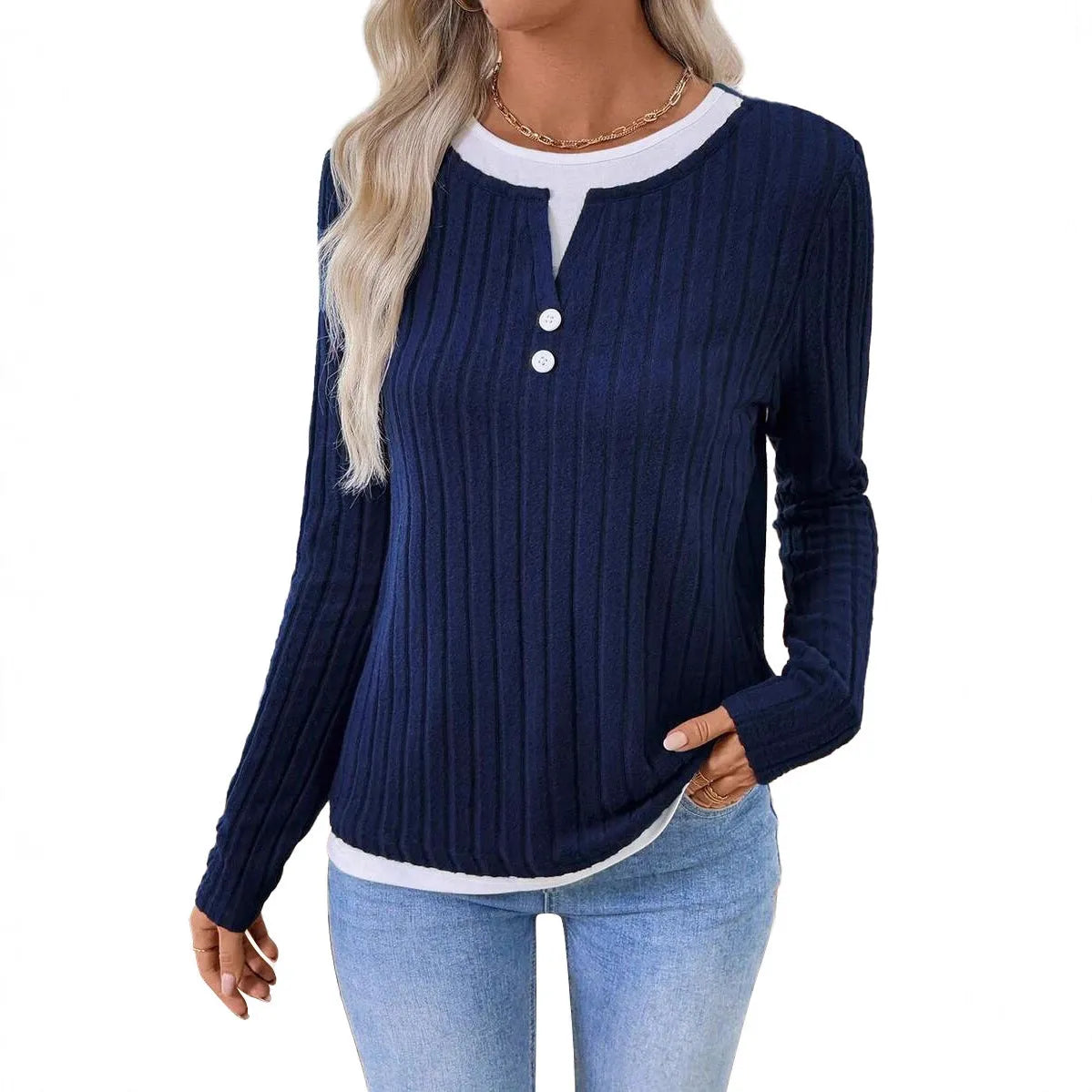 Women's black fake two-piece pullover sweater with button front and round neck on a hanger.