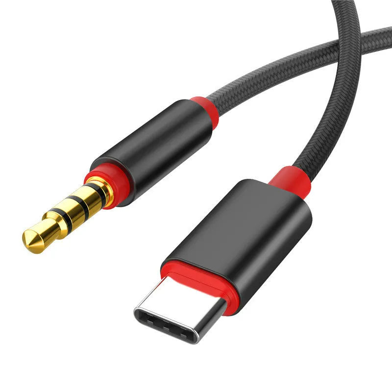 Silver nylon-braided audio cable with 3.5mm connectors on a plain background.