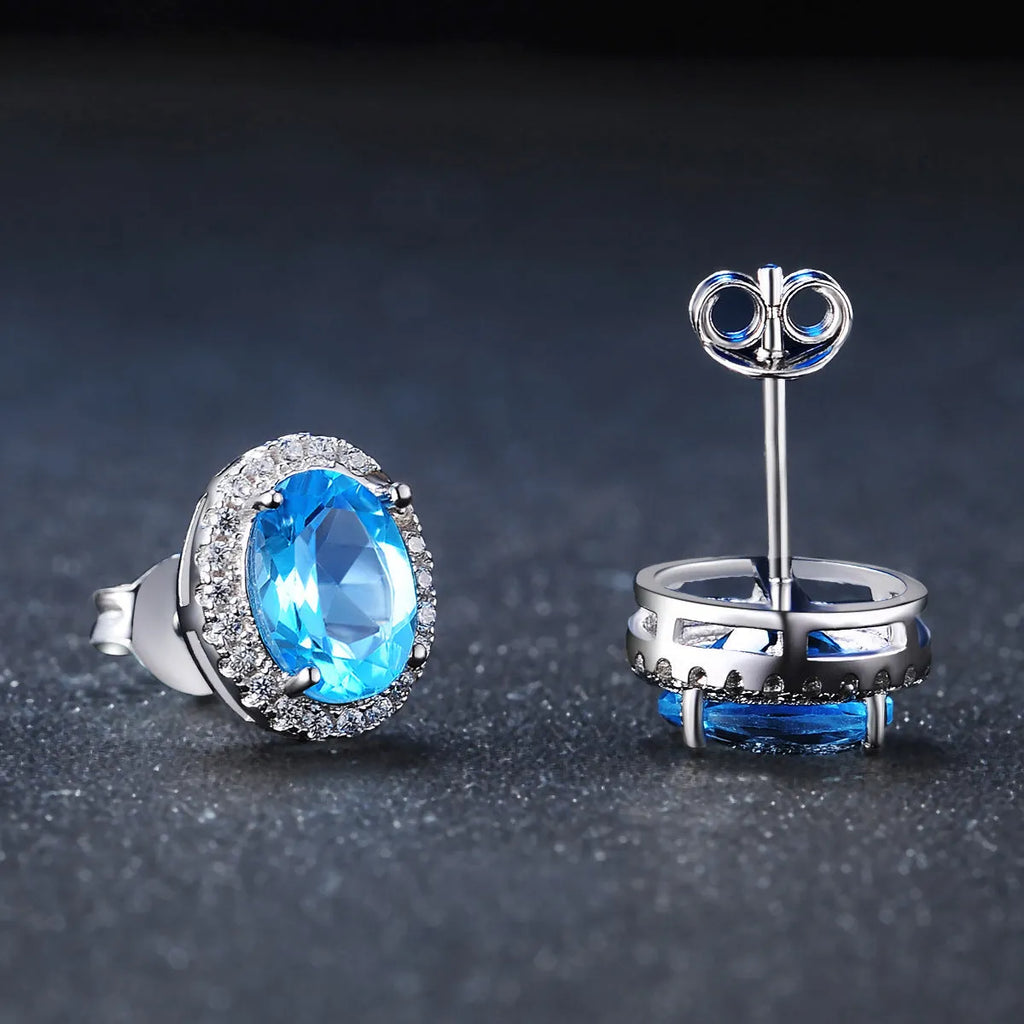 925 sterling silver geometric jewellery set with blue topaz stones including earrings, ring, bracelet and necklace