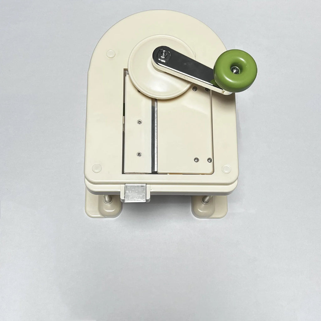 Beige household vegetable slicer chopper with stainless steel blades for shredding potatoes.