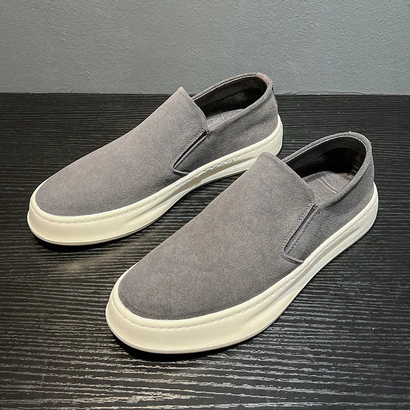 Men's casual shoes in solid grey colour with round toe, mid heel, and sewing line detail