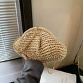 Shell-shaped straw shoulder bag with chain trim in khaki colour