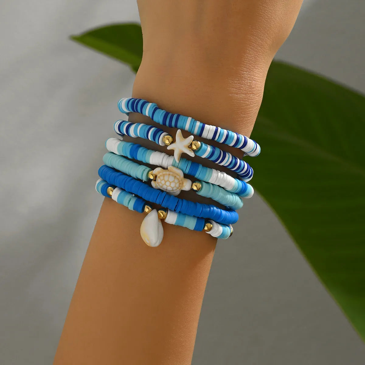 Set of six blue polymer clay handmade shell bracelets with geometric design, unisex bohemian style