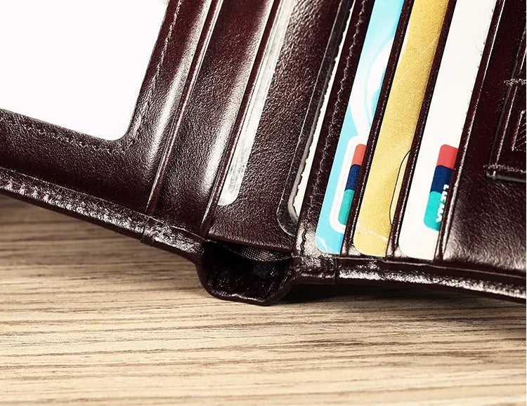 Men's black or brown leather wallet open to show photo window, card slots, and coin pocket.