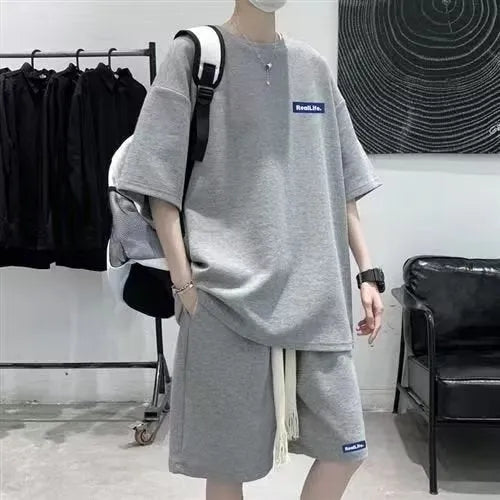 Man's waffle texture leisure sports suit with short sleeves and shorts in blue