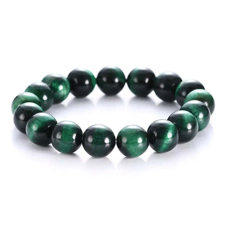 Green tiger eye stone bracelet with geometric polished beads showing banded natural patterns