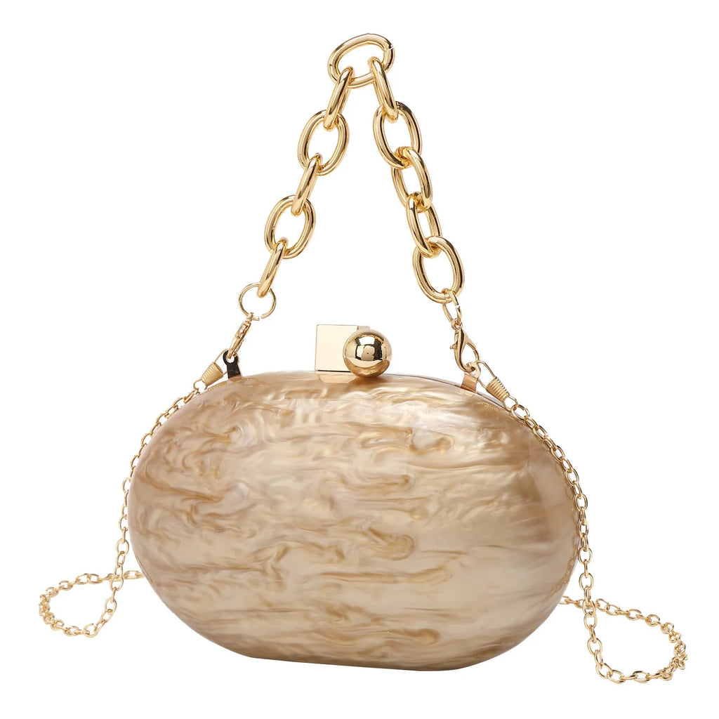 Oval acrylic chain crossbody handbag in pearlescent white with chain strap and hard shell structure