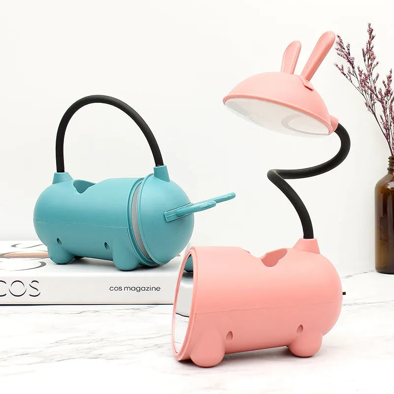Green cartoon desktop USB table lamp with built-in pen holder container.
