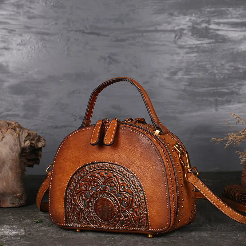Vintage leather handbag showing interior compartments including ID holder and phone pouch