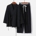 Cotton and linen Hanfu two-piece suit in apricot with shirt-style top and matching trousers on a model
